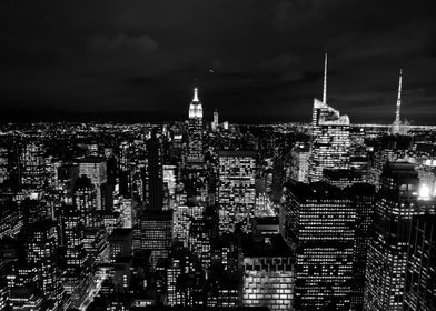 black and white photograph of new york city at night