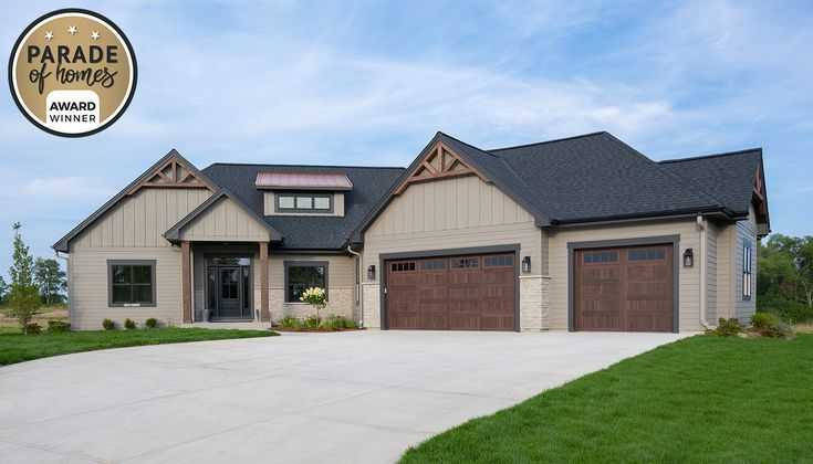 a large house with two garages and an award for best home in the world