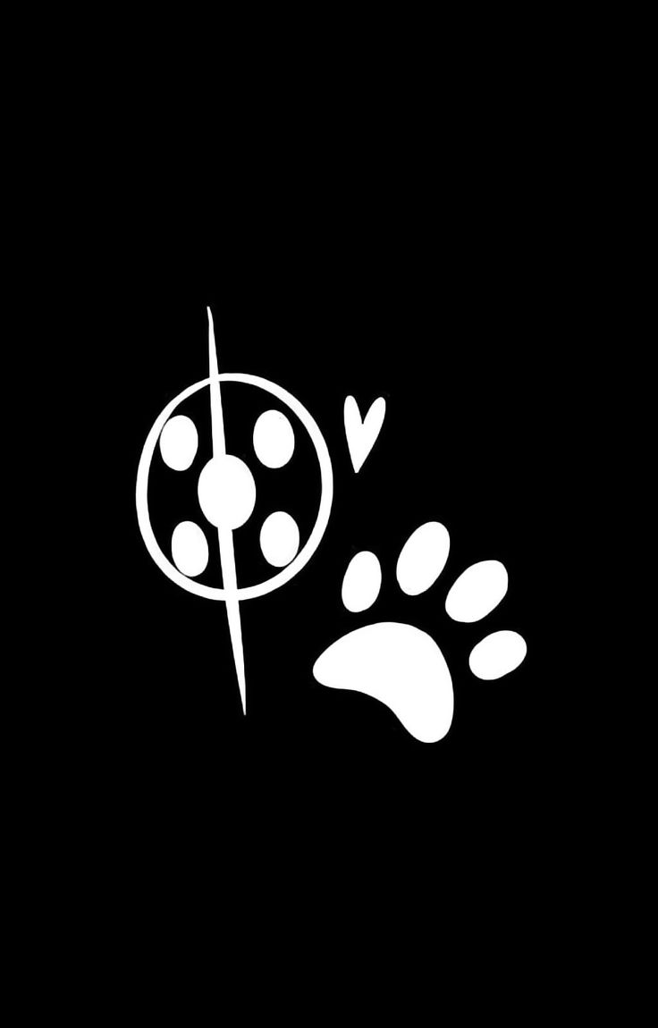 a black and white image of a dog's paw with a target in the middle