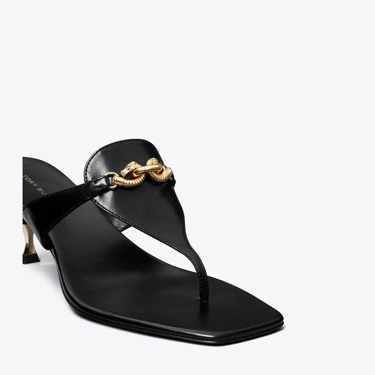 The silhouette of a flip-flop is reimagined with trapezoidal side straps, designed to beautifully frame the foot. A scaled-down take on Jessa's horsehead hardware embellishes the leather upper and a gold-tipped low kitten heel elevates the '90s-style sandal.Crafted in partnership with a Leather Working Group-certified tannery, supporting high standards in leather manufacturing and chemical management. Formal Sandals With Metal Feet And Open Heel, Chic Sandals With Heel Strap And Toe Loop, Designer T-strap Sandals With Removable Insole, Designer Toe Post Sandals, Chic T-strap Sandals With Toe Post And Buckle Closure, Luxury T-strap Sandals With Single Toe Strap For Evening, Luxury T-strap Sandals With Removable Insole, Luxury Evening T-strap Sandals With Single Toe Strap, Leather Sandals With Metal Feet And Single Toe Strap