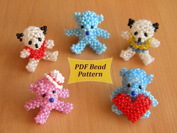 four small teddy bears made out of bead on a table with a sign that says pdf bead pattern