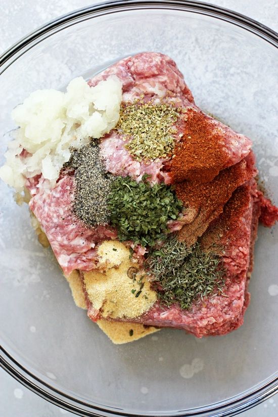 a glass plate topped with meat and seasonings