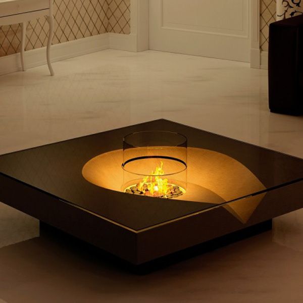 a fire pit in the middle of a living room