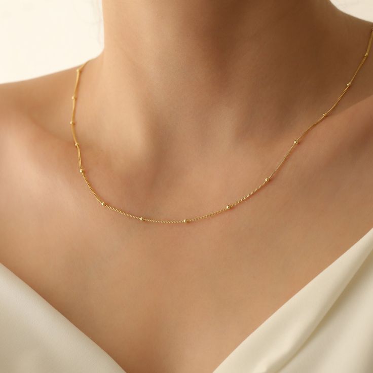 14k Gold Beaded Satellite Chain,Gold Filled,Sterling Silver or Rose,Dew Drops,Simple,Everday Layering Necklace 👀 ❤️The model is wearing the necklace in 16 inches length. ❤️Product Details ❤️Handmade / Handcrafted Fine Jewelry ❤️Metal:14K Gold Filled ❤️Chain Width: Approx. 3mm Colors: Silver Gold Rose Gold Other styles are available in our shop at https://www.etsy.com/shop/GoldPersonalized?ref=seller-platform-mcnav Please contact us if you have any questions or requests/ideas for our shop, we'd Dainty Jewelry With Tiny Beads For Anniversary, Dainty Anniversary Jewelry With Tiny Beads, Classic Jewelry With Delicate Chain And Round Beads, Dainty Clavicle Chain With Round Beads Jewelry, Dainty Rose Gold Chain Necklace With Satellite Chain, Minimalist Rose Gold Satellite Chain Necklace, Elegant Gold-tone Jewelry With Satellite Chain, Dainty Gold-tone Jewelry With Satellite Chain, Dainty Gold-tone Necklace With Satellite Chain