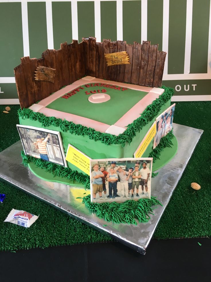 a cake that is shaped like a baseball field with pictures on the bottom and sides