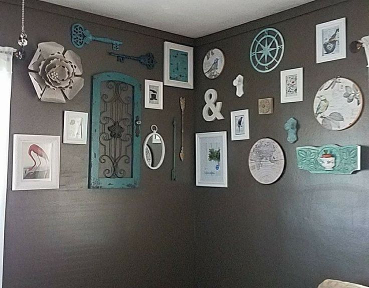 there are many pictures on the wall in this room and it is decorated with various things