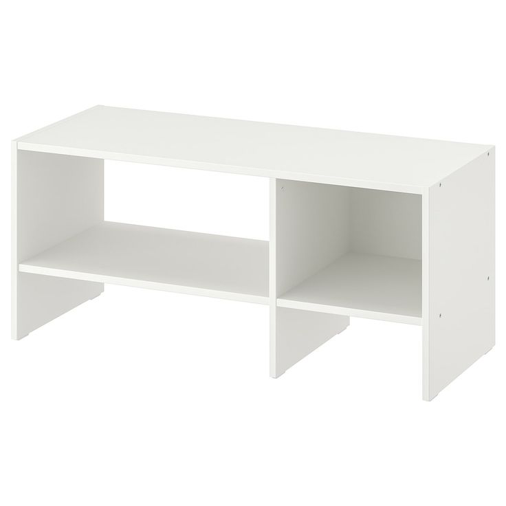 a white table with two shelves on one side and an open shelf on the other