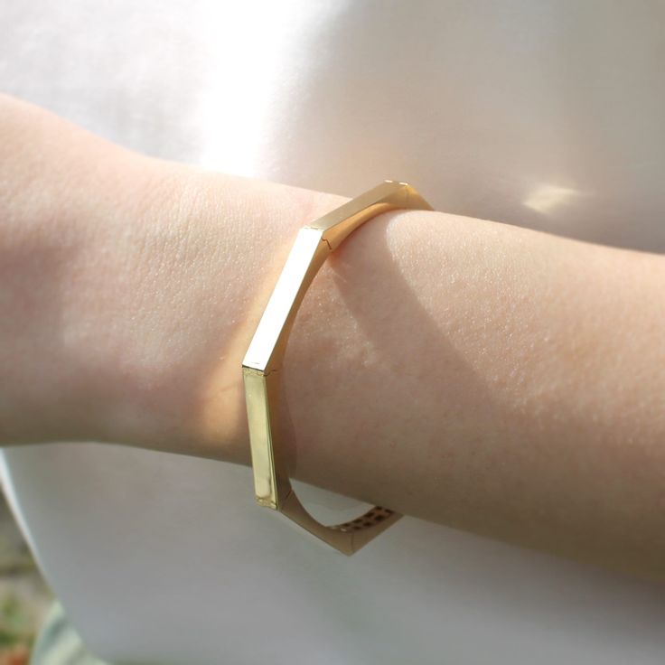 Elevate your accessory game with our solid gold geometric bracelet, available exclusively on Etsy. This unique and timeless cuff bangle is a perfect luxury gift for loved ones, and is sure to add sophistication to any outfit. Shop now and make a statement with this stunning piece of jewelry. Size: 60 mm Width (inside measurements) Material: 14K Gold Karat: 14 Karats Gold (585) BEST CHOICE FOR GIFT🎁 You can buy the best gifts for your loved ones from this shop with our special packaging that we use for each product. DELIVERY🚀 Your order will be crafted and ready to ship within 1 - 5 business days.We use express shipping for all orders.Please contact us if you have any urgency. Estimated delivery time: USA 1-3 days EU   1-3 days AUSTRALİA  2-7 days CANADA  2-4 days Other 2-8 days Elegant Geometric Bracelets Gift, Elegant Geometric Bracelets For Gift, Elegant Geometric Bracelets For Gifts, Gold Geometric Bracelet For Gift, Elegant Adjustable Geometric Bracelet, Modern 14k Gold Bangle As Gift, Modern 14k Gold Cuff Bracelet As Gift, Modern 14k Gold Cuff Bracelet Gift, Modern 14k Gold Cuff Bracelet For Gifts