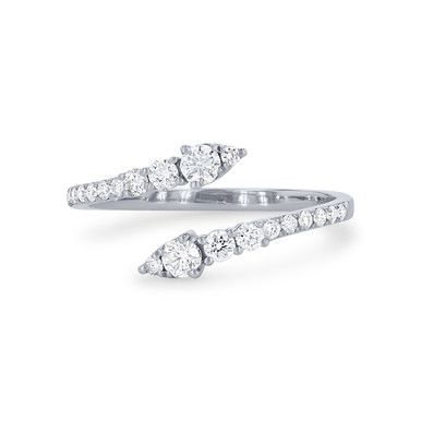 two white gold rings with diamonds on each side and one diamond set in the middle