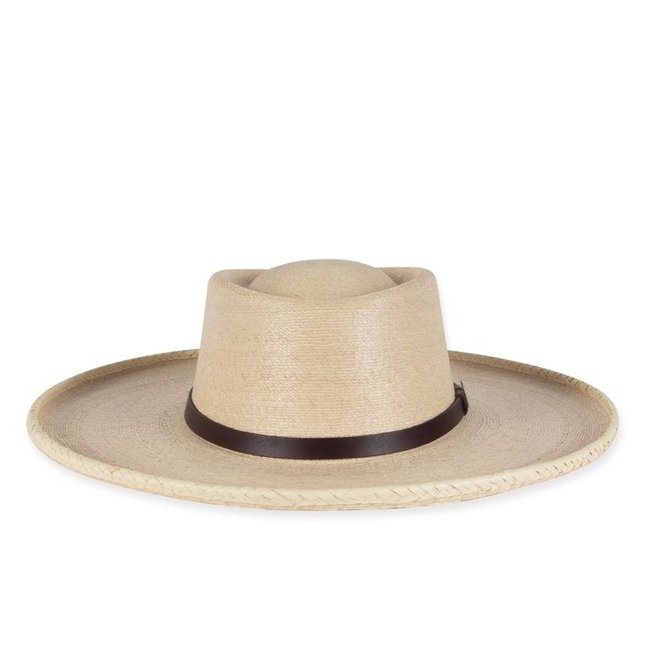 *PLEASE NOTE THIS ITEM IS FINAL SALE AND CAN ONLY BE RETURNED FOR STORE CREDIT OR EXCHANGE.* The Buckaroo, was the Americanized version of the Vaquero, often wearing flat hats with an upward curve in the back and riding A-fork saddles. The Los Tres Buckaroo features genuine Mexican Palm, and boasts a 1" brown leather hat-band and custom Seager horseshoe pin Features: Made from Mexican Palm 1" brown leather hat-band 4" rolled brim Custom Seager horseshoe pin Brown drilex interior sweatband with g Buckaroo Hats, Brown Leather Hat, Mexican Palm, Flat Hats, Leather Hat, Hat Box, Western Hats, Leather Hats, Berets