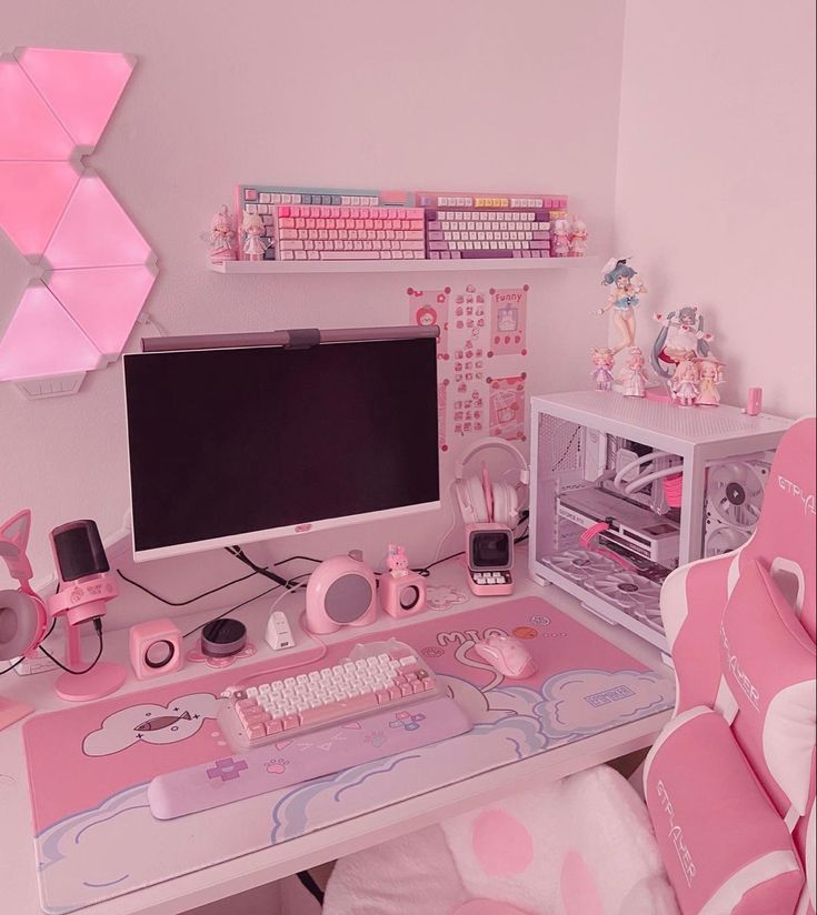 a desk with a computer, keyboard and mouse on it in a room decorated in pastel colors