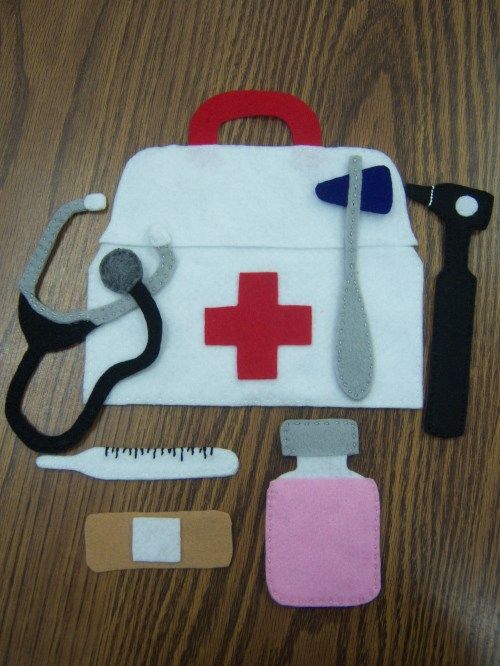 an assortment of medical supplies laid out on a wooden table with scissors and tape measure