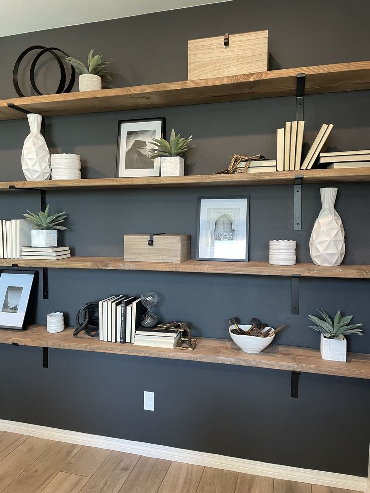 some shelves with books and pictures on them