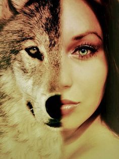 a beautiful woman with blue eyes and a wolf's head on her chest is looking at the camera