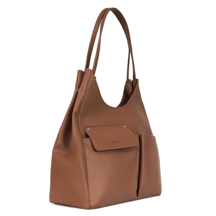 This spacious tote has two front pockets, a magnetic snap closure, and folded side panels with press snaps. Matt & Nat is certified vegan and cruelty-free DIMENSIONS: 5.5"W x 13.5"L x 14.5"H, 11" handle drop FEATURES: interior zipper pocket, smartphone pocket MATERIALS: recycled PVB-material vegan leather lined with 100% recycled water bottles CARE: spot clean with a damp cloth and mild soap Ethically made in China On-the-go Tote Satchel With Magnetic Closure, Modern Satchel With Magnetic Closure For On-the-go, Versatile Everyday Hobo Bag With Magnetic Closure, Versatile Everyday Satchel With Snap Closure, Everyday Rectangular Hobo Bag With Magnetic Closure, Modern Everyday Hobo Bag With Snap Closure, Everyday Brown Hobo Bag With Magnetic Closure, Modern Brown Bag With Pockets, Modern Everyday Satchel With Magnetic Closure