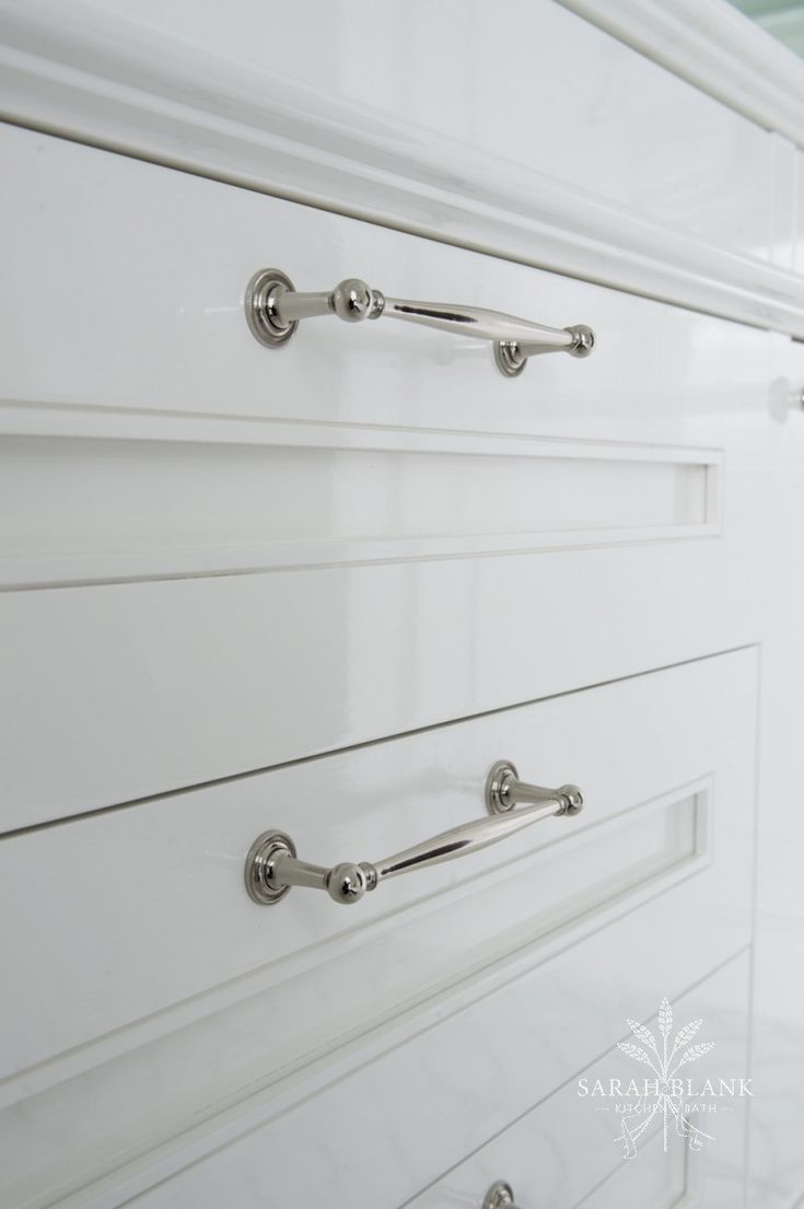 white drawers with chrome handles and knobs