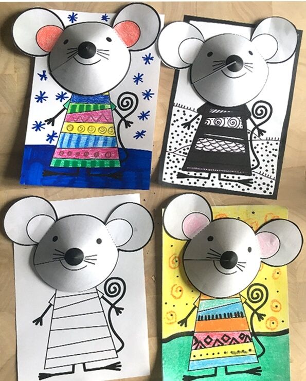 three paper mouses with different designs on them