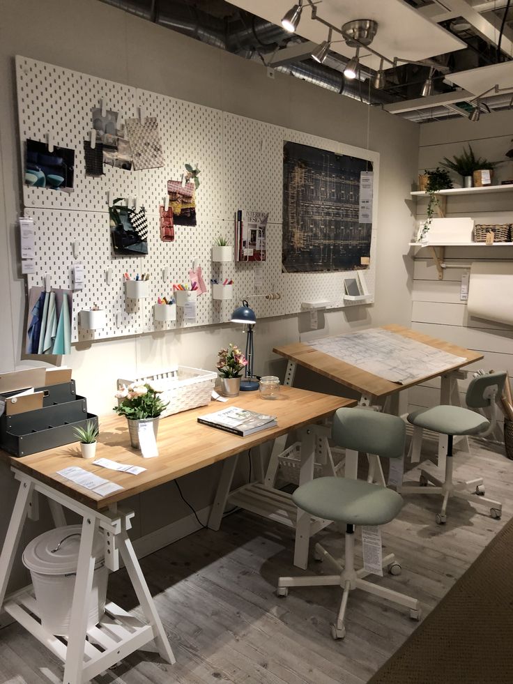 an office with several desks and chairs in it's center area, including one for each person