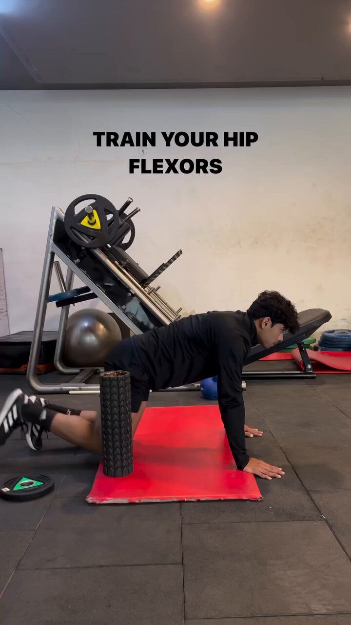 a man doing push ups on a red mat in front of a wall with the words train your hip flexors