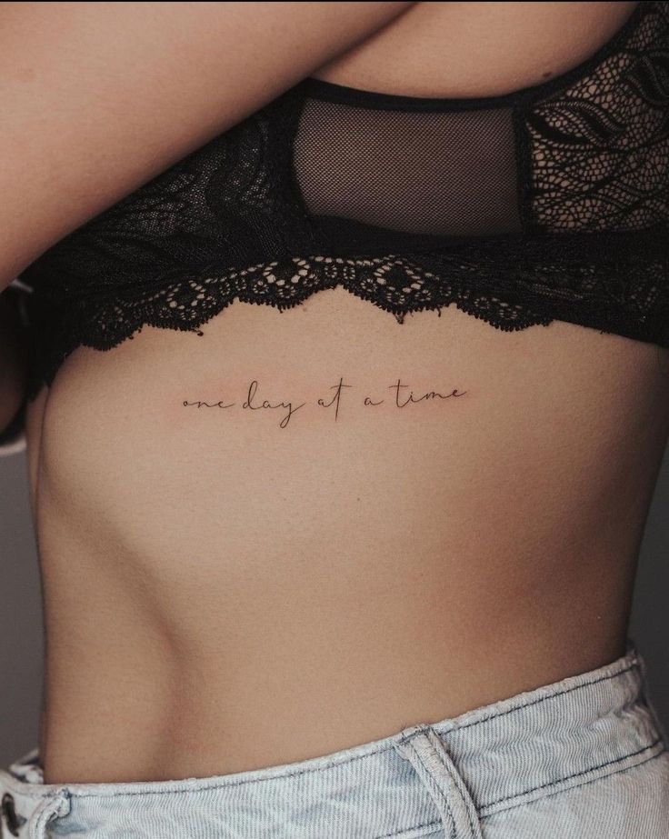 a woman's stomach with the words, one day of time written on it