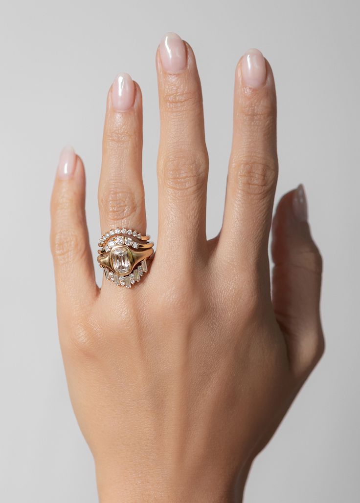 a woman's hand with a ring on it