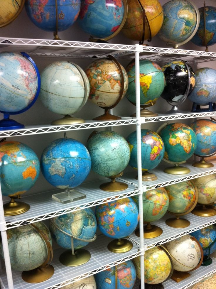 several shelves filled with lots of different colored globes