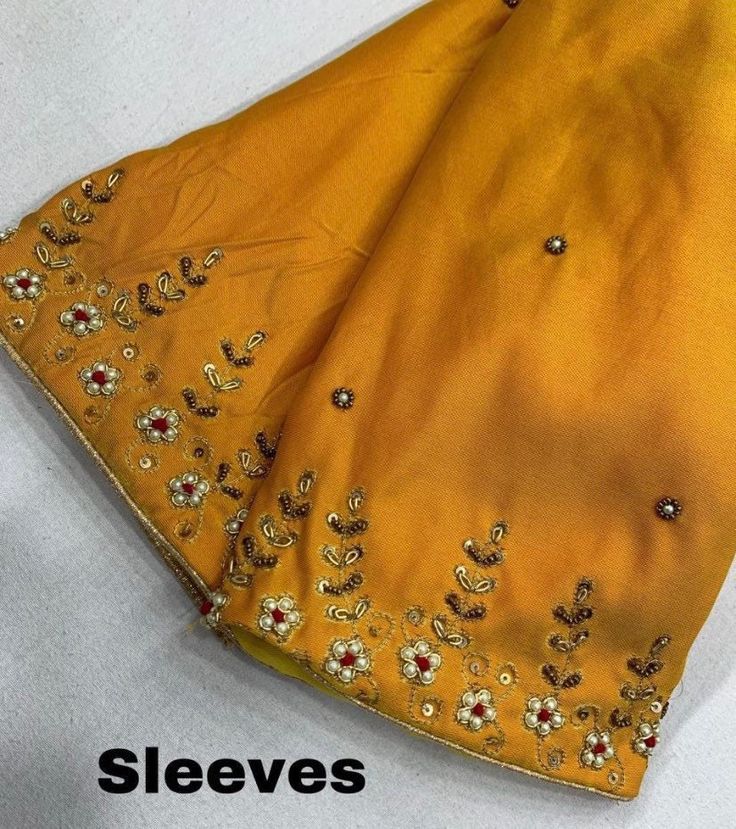 This gorgeous handmade maggam work readymade saree blouse available to ship immediately. Blouse size fits 36-40 and inch margin. Disclaimer : There might be little color variation because of photography and gadget settings, Zari Folding's and Thread Outcomes are not considered as Damage. Blouses are tailored by masters in tailoring to ensure good fitting quality. Product displayed only will be dispatched For any questions please message 832-497-7140 Yellow Saree Maggam Work Blouse, Yellow Zari Work Blouse For Puja, Diwali Yellow Blouse With Mirror Work, Festive Yellow Saree With Mirror Work, Yellow Silk Saree With Mirror Work, Sequence Saree, Readymade Saree, Embroidery Saree, Maggam Work