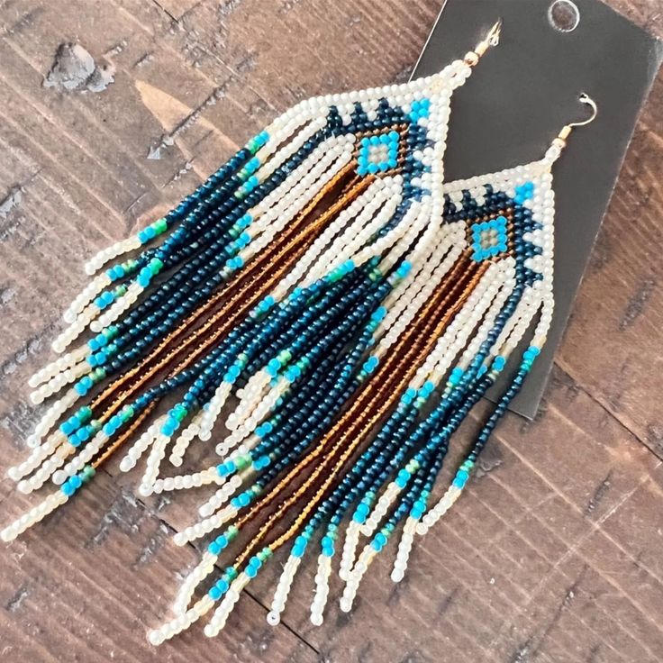 Stunning Southwestern Native American Tribal Beaded Earrings New Measuring 5” Long, These Gorgeous Earrings Have Teal, Cream, And Light Brown Beading. The French Hooks Are Hypoallergenic And Come With Backs. Smoke Free Home With Next Day Shipping From Sc. I Relist Every 61 Days, So If You Don't Purchase This Item Or Make Me An Offer Within 61 Days, It Will Be Relisted To The Original Price. Listed On 6-2-2024 Relist On 8-3-2024 Thank You For Visiting My Closet. Earring Patterns Beaded, Seed Bead Patterns Free Earrings, Beaded Feather Earrings, Ant Spray, Native Regalia, Seed Bead Patterns Free, Native Beading Patterns, Unique Handmade Earrings, Native American Beaded Earrings