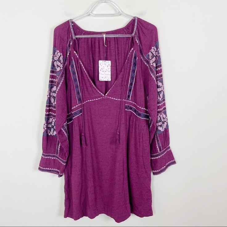 Brand New With Tags. All My Life Mini Dress. Tie Tassel Closure. Pockets. Excellent Condition! Size: Small Approximate Measurements: Shoulder To Hem 34”. Pit To Pit 19.5”. 746 Casual Boho Dress With Floral Embroidery V-neck, Purple V-neck Dress With Floral Embroidery, Free People Boho Dress, Long Sleeve Embroidered Dress, Boho Tunic Dress, Embroidered Dress Boho, Macrame Dress, Midi Wrap Dress, Boho Tunics