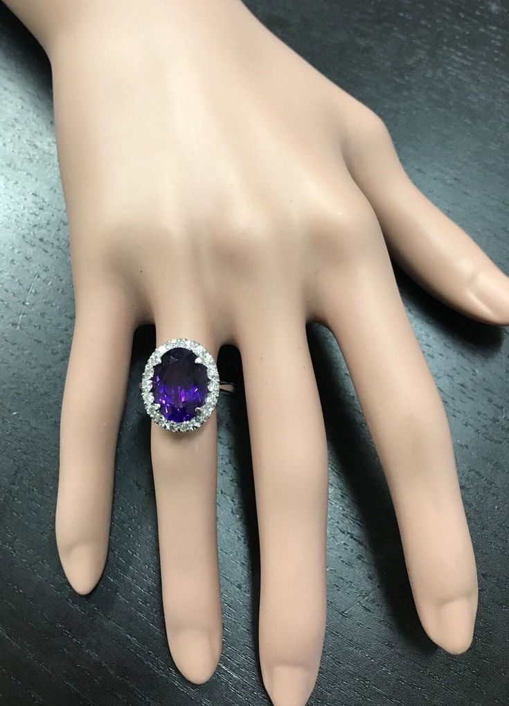 6.25 Carats Natural Amethyst and Diamond 14K Solid White Gold Ring Suggested Replacement Value: $5,200.00 Total Natural Oval Amethyst Weights: Approx. 5.50 Carats Amethyst Measures: Approx. 14.00 x 10.00mm Natural Round Diamonds Weight: Approx. 0.75 Carats (color G-H / Clarity SI1-2) Ring total weight: Approx. 6.4 grams Disclaimer: all weights, measurements and colors are approximate and may vary slightly from the listed dimensions or as seen in the image. All pictures are magnified to show the Emerald Cut Aquamarine Ring, Emerald Cut Rings, Etsy Gold Ring, Amethyst Gem, Purple Band, Aquamarine Rings, White Gold Ring, Natural Aquamarine, Quality Diamonds