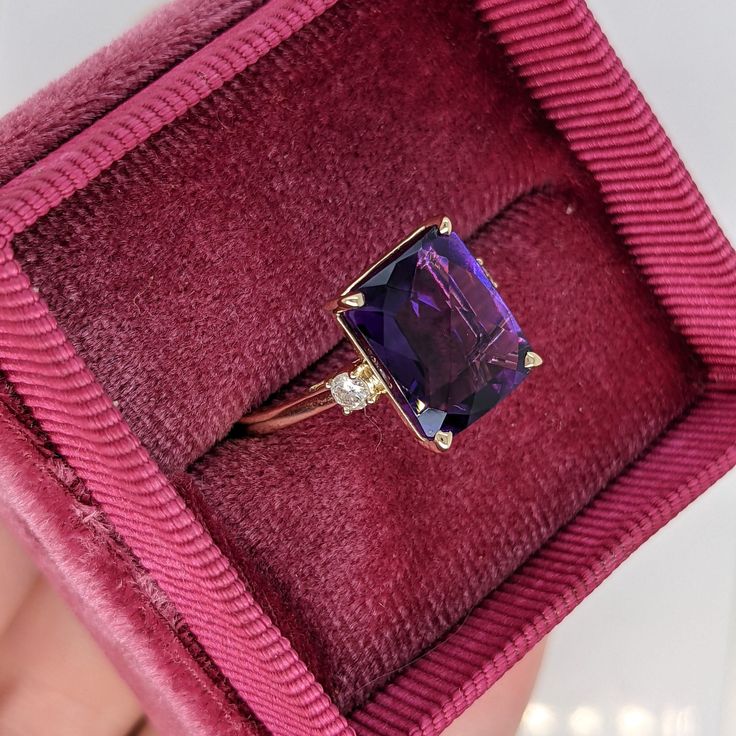 This cocktail ring features a stunning vibrant deep purple amethyst in 14K gold with diamond accents. This statement ring makes for a stunning accessory to any look! A fancy ring design perfect for an eye-catching engagement or anniversary. This ring also makes a beautiful February birthstone ring for your loved ones. Designer Silver Jewellery, Purple Amethyst Ring, Fancy Rings, Jewelry Showcases, Pendant Bracelet, February Birth Stone, Amethyst Ring, Earring Findings, Purple Amethyst