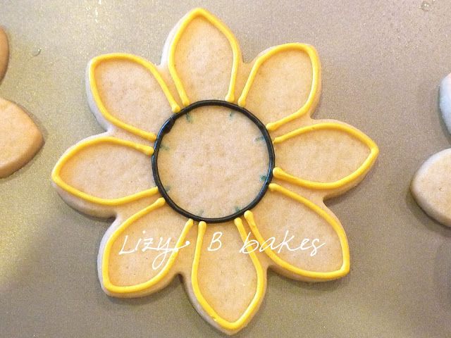 a cookie decorated like a flower with a magnifying glass in the center