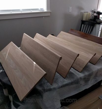 four pieces of wood sitting on top of a table