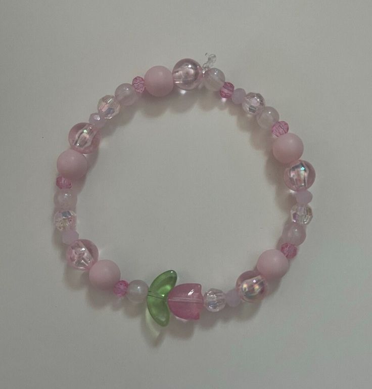 A pink tulip flower bracelet Cute Cheap Pastel Bracelets, Pink Beaded Bracelets For Spring, Tulip Bracelet, Pulseras Aesthetic, Pink Beaded Bracelets, Manik Manik, Bracelets Ideas, Resin Bracelet, Pola Gelang