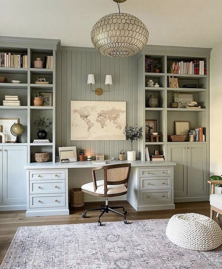 a home office with built in bookshelves and desk