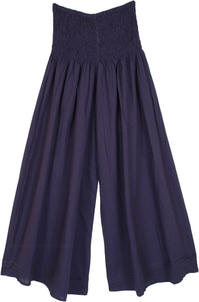 A lightweight cotton wide leg palazzo pants with a smocked waist.  These navy blue pants feature a smocked elastic waist for a comfortable fit. #tlb #SplitSkirtsPants #vacationclothing #bohemianfashion #WideLegPants #NavyPants #VacationPants Cotton Culottes With Elastic Waistband, Solid Cotton Wide Leg Pull-on Pants, Cotton Wide Leg Pull-on Pants, Indigo Wide Leg Pants With Elastic Waistband, Blue Wide-leg Harem Pants With Elastic Waistband, Cotton Wide-leg Pull-on Harem Pants, Wide Leg Cotton Harem Pants With Pull-on Style, Casual Blue Bottoms With Smocked Back, Navy Wide-leg Pants With Elastic Waistband