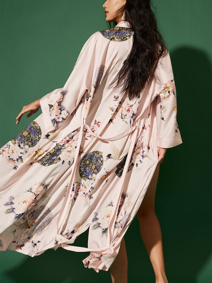 Wrap yourself in the luxurious feel of our ultra-soft, high-quality fabric, adorned with hand-painted floral prints. Designed to care for your skin morning and night, our robe kisses away wrinkles, ensuring joy for every occasion. Experience unmatched comfort and elegance, making each moment a celebration of beauty. • Silky Comfort: Made of high-quality polyester charmeuse, our robes are soft, lightweight and cooling for summer. They have a smooth and breathable texture that feels just like natu Feminine Summer Kimono For Loungewear, Pink Long Robe For Spring, Feminine Long Sleeve Kimono For Loungewear, Pink Kimono For Home Use In Spring, Pink Sleepwear With Kimono Sleeves For Spring, Long Pink Robe For Spring, Spring Feminine Robe With Kimono Sleeves, Feminine Summer Loungewear Kimono, Spring Long Robe For Home