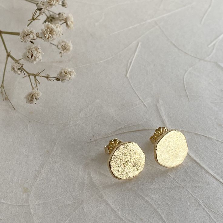 This classy and simple round gold stud earrings are the perfect accessory for a romantic evening out or for everyday use. Shaped like small gold dots. These circular studs have been crafted from 14K gold a satin finish that adds a quiet chic to any look. Gift them as an anniversary present, a birthday gift for your bestie, a thoughtful gift for mom - or better yet, give them to yourself!  INFO ♡ Made of 14K gold. ♡ Push back closure. SHIPPING ♡ Shipped beautifully and safely via registered airma Minimalist 14k Gold Earrings Gift For Her, Minimalist 14k Gold Earrings As Gift For Her, Minimalist Gold Plated Circle Earrings, Minimalist Earrings As Gift For Her, Minimalist Gold-plated Circle Earrings, Minimalist Round Earrings For Her, Minimalist Round Earrings As Gift For Her, Minimalist Hammered Round Earrings, Minimalist Hammered Earrings For Wedding