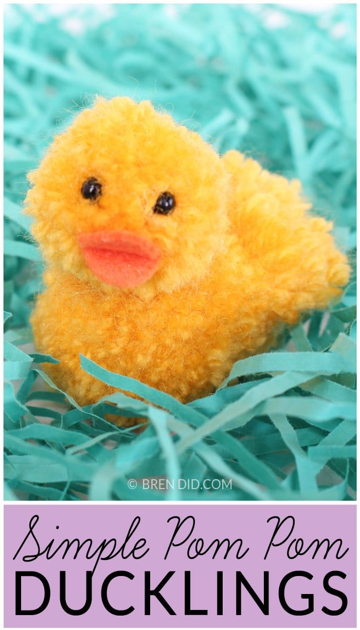 a small yellow duckling sitting on top of green grass with the words, simple pom - pom ducks