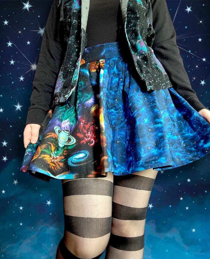 Measurements: Mid waist: 32in Length: 17in Would best fit someone with a 31 inch waist. This skirt contains zero stretch and would best fit someone whose waist is about an inch smaller than that of the skirt. This cute little skirt is handmade from two galaxy themed cotton fabrics! The skirt comes in a pleated style that's attached to a fitted waist band with a zipper that runs down the back. It's also designed to sit at the mid waist, allowing it to hang freely over the hips giving it a much fuller and cuter look! Custom sizes are not available. Fitted Mini Bottoms For Cosplay, Fitted Mini Skirt For Cosplay, Fitted Mini Length Bottoms For Cosplay, Fitted Mini Skirt With Elastic Waistband For Night Out, Blue Fitted Skirt For Cosplay, Fitted Blue Skirt For Cosplay, Fitted Pleated Skirt For Cosplay, Fitted High Waist Multicolor Mini Skirt, Multicolor Fitted High Waist Mini Skirt