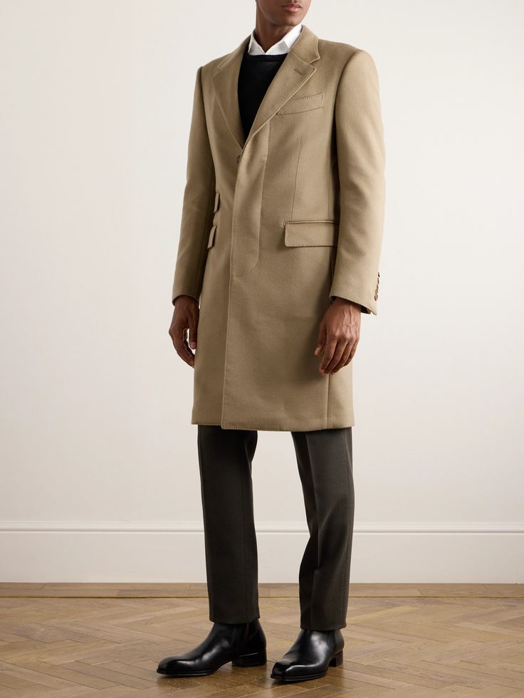 TOM FORD's classic tailored coat is cut from in an elegant longline profile from a supremely soft blend of brushed wool and cashmere. It's detailed with smart notch lapels and a concealed placket for a seamless finish.