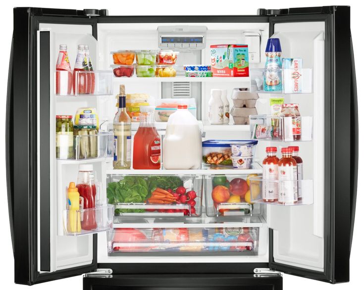 an open refrigerator filled with lots of different types of food and drink bottles on the door