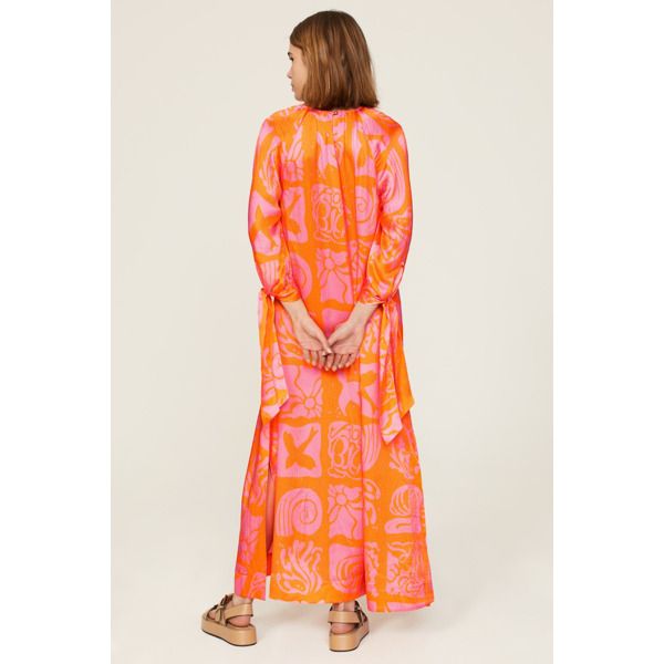 Orange printed silk (100% Silk). Caftan. 3/4 sleeves. Crew neck. Back button closure. 53.5" from shoulder to hemline. Imported. Spring Dresses With Abstract Print And Kimono Sleeves, Spring Daywear Long Sleeve Kaftan, Silk Summer Dress With 3/4 Sleeves, Summer Silk Dress With 3/4 Sleeves, Orange Long Sleeve Kaftan For Spring, Chic Long Sleeve Silk Kaftan, Long Sleeve Orange Kaftan For Spring, Orange Long Sleeve Spring Kaftan, Floral Print Long Sleeve Kaftan For Daywear