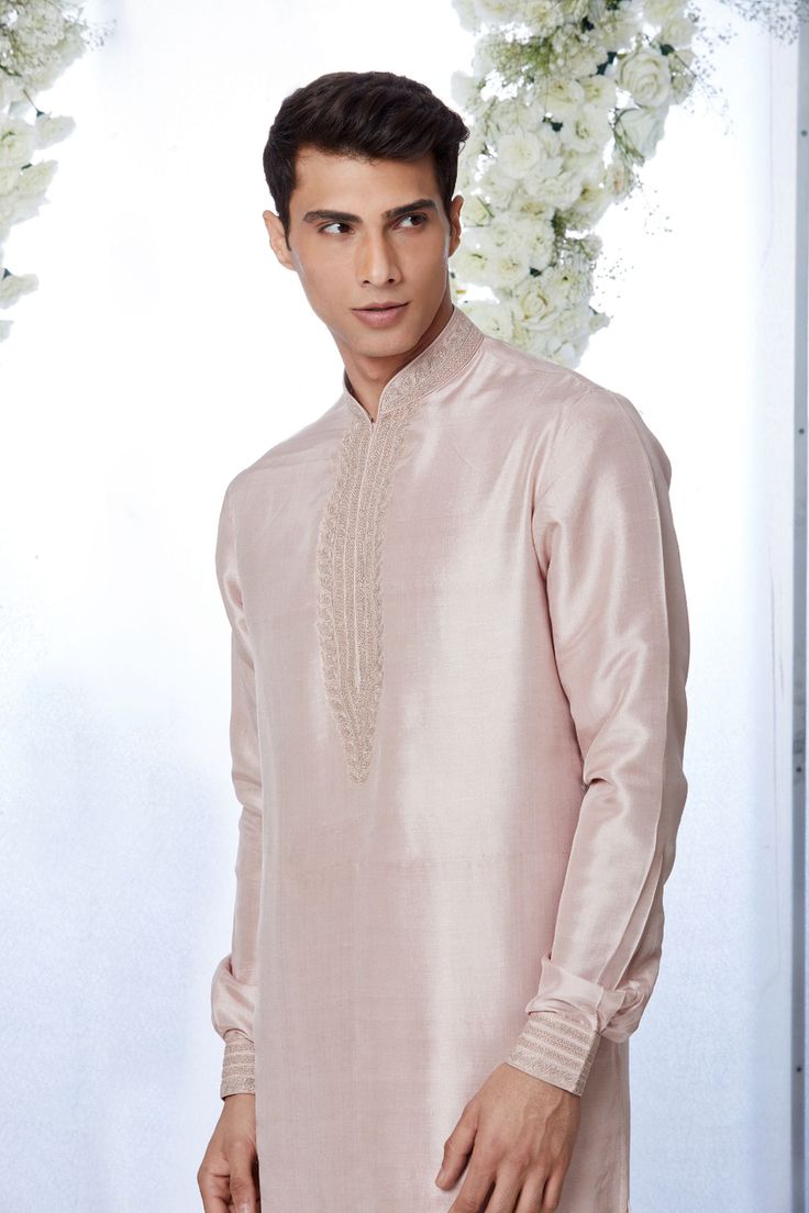 This rose gold silk kurta set features kiran dori embroidery on the collar, cuff and placket. It is paired with a jacquard trouser. Complimenting footwear is also available.From Seema Gujral's Tuscan Summer collection. DELIVERY TIMEPlease allow 8-12 weeks for your outfit to arrive.FABRIC DETAILSSilkProfessional cleaning only. Designer Straight Kurta For Diwali, Designer Churidar With Resham Embroidery For Eid, Designer Unstitched Straight Kurta, Designer Chanderi Kurta For Festive Occasions, Designer Chanderi Kurta For Eid, Festive Designer Kurta With Chikankari Embroidery, Designer Resham Embroidery Churidar For Eid, Designer Straight Kurta For Reception, Designer Festive Churidar With Resham Embroidery