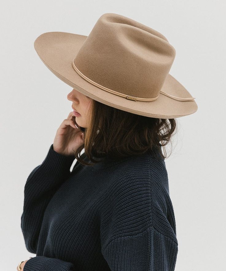 Ezra blends statement fashion with Western. A classic cattleman crown made to be styled for the city as much as the countryside. This hat features an upturned brim + a tall crown, giving Ezra a modern + feminine feel. Ezra comes with a removable tonal grosgrain band featuring a brass Gigi Pip pin. Other bands pictured are sold separately. Country Style Boater Hat For Rodeo With Curved Brim, Classic Unlined Hat With Curved Brim, Classic Brimmed Boater Hat For Country Events, Classic Boater Hat With Short Brim For Country Events, Classic Boater Hat For Country Events With Short Brim, Classic Brimmed Hat, Western Style Flat Brim Hat For Spring, Western Style Fedora With Flat Brim, Western Fedora With Flat Brim