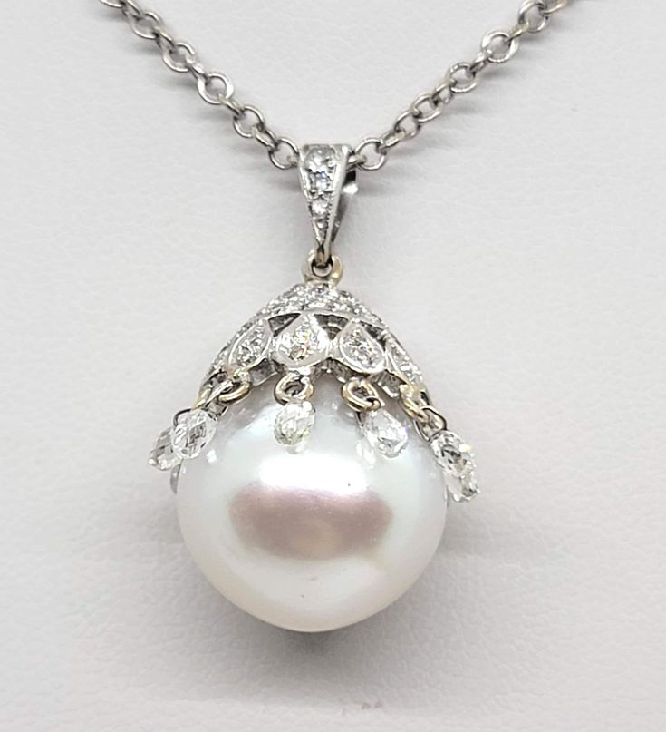 Pearl Diamond Necklace 14K White Gold, 16 inch Chain Beautiful Gift for your loved one Total diamonds approximately 0.15 CT Total weight 10.22 g Item will be put in a Gift Box Luxury Diamond White Diamond Necklace With Pearl Pendant, Luxury Diamond Pearl Necklace With Pendant, Briolette Diamond Necklace For Anniversary, Evening White Diamond Necklace Brilliant Cut, White Brilliant Cut Diamond Necklace For Evening, Classic White Briolette Diamond Necklace, White Gold Briolette Diamond Necklace For Anniversary, White Gold Briolette Diamond Necklace For Wedding, White Hallmarked Diamond Necklace For Formal Occasions