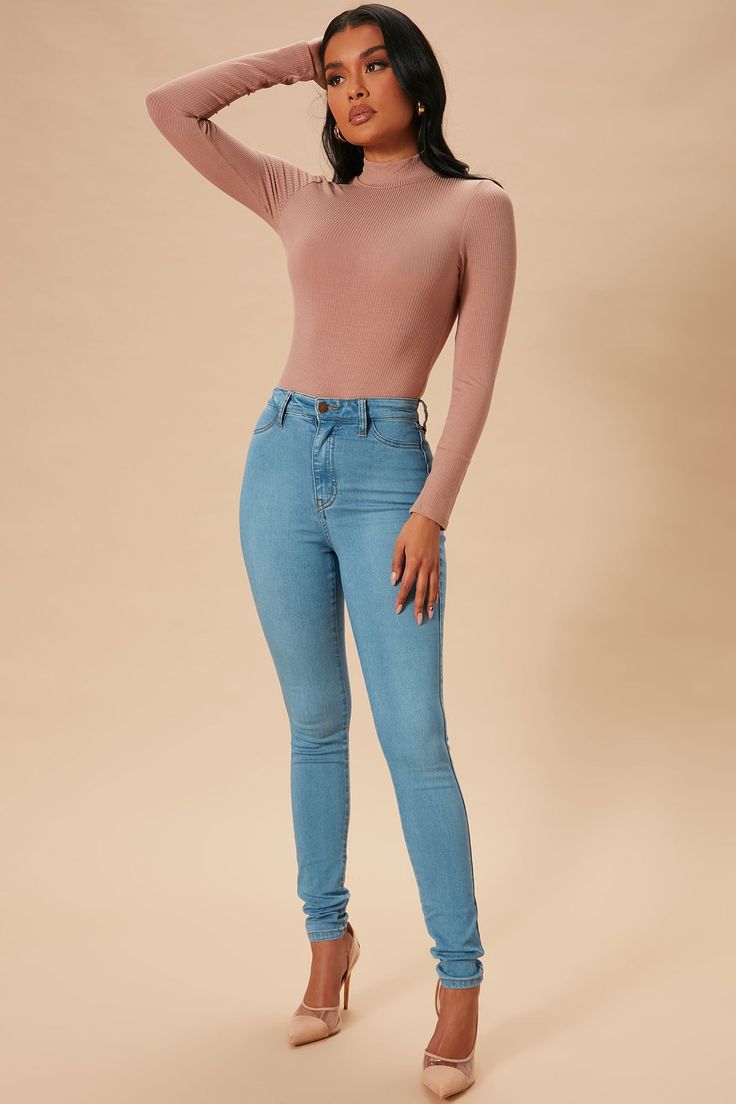 Say hi to your waist as you slip into our best-selling flexible stretch denim pants. The Classic High Waist Skinny Jeans feature a dark wash, 2 back pockets, 2 faux front pockets, a zip fly closure, and are available in Curve. Providing a seamless transition from day to night, these jeans are a wardrobe essential. Available In Multiple Washes Available in Petite 28" Inseam, Regular 31" Inseam, & Tall 34" Inseam 11" High Rise Skinny Jean High Stretch Faux Front Pockets Functional Back Pockets Dis Stretch Denim Pants, Curve Jeans, Seamless Transition, Curve Dresses, Womens Loungewear, Rompers Women, Say Hi, High Jeans, Denim Pants