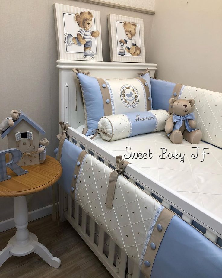 a baby crib with teddy bears on it