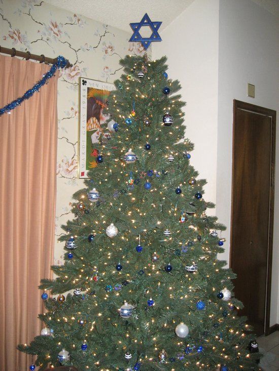 a christmas tree with blue and silver ornaments