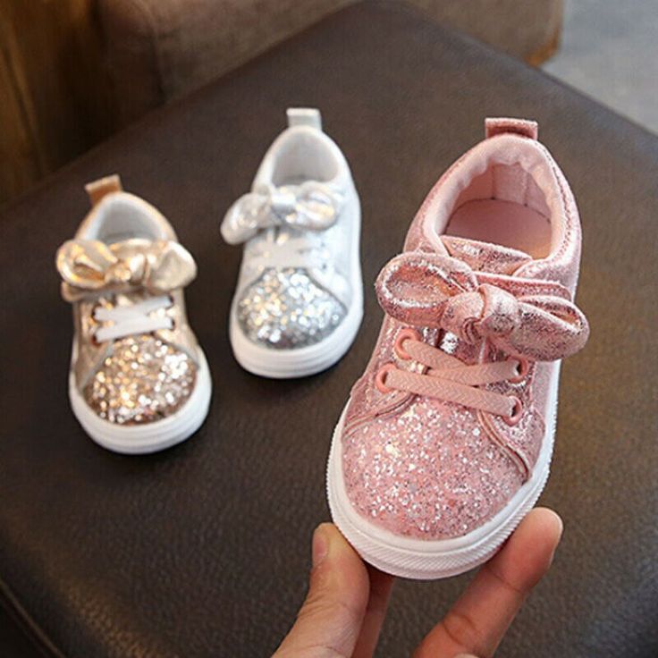 Not all that glitters are expensive! And so are these Glittered Bowknot Sneakers that shine and make those little feet walk with comfort and style. Give your baby the best first walker fashion sneakers to match a good-looking outfit for that adorable overall look! Features: Paillette fashion element Flexible rubber sole Soft and comfortable footwear for babies Adjustable lace closure type Accent bow and glittered texture finish Size Chart (Inches): To get insole length, please measure your child Girls Glitter Shoes, Baby Nike Shoes, Baby Stores, Baby Tummy Time, Foot Shoes, Bowknot Dress, School T Shirts, Trendy Family